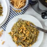 crockpot green bean casserole on white plate.