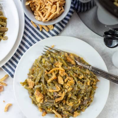 crockpot green bean casserole on white plate.