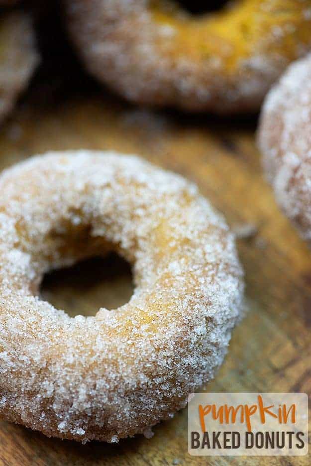 A close up of a doughnut on a cutting board.