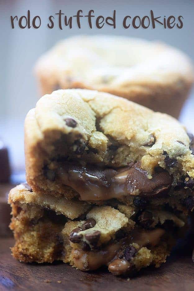 A close up of a piece of cookie stacked on another cookie.