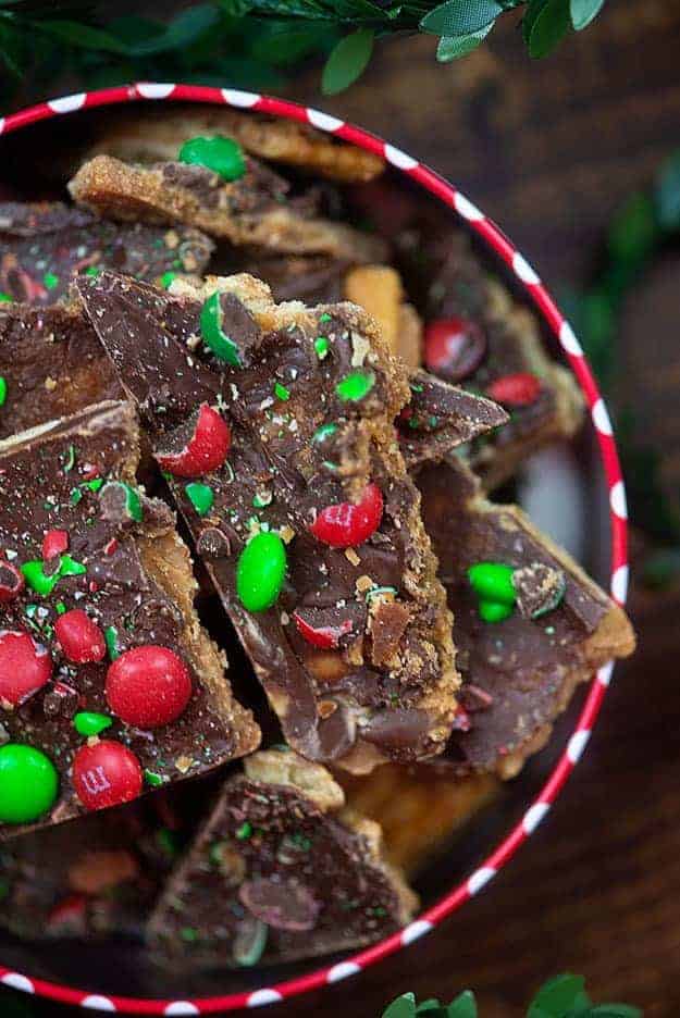 A close up of a plate full of christmas toffee.