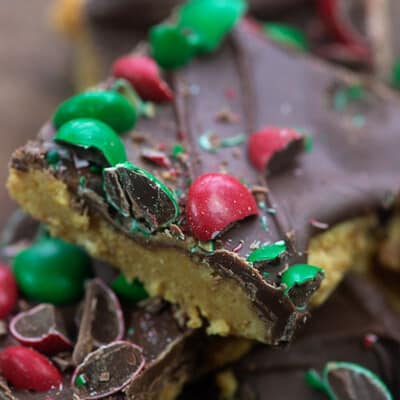 Peanut butter bars topped with chocolate and M&M's.
