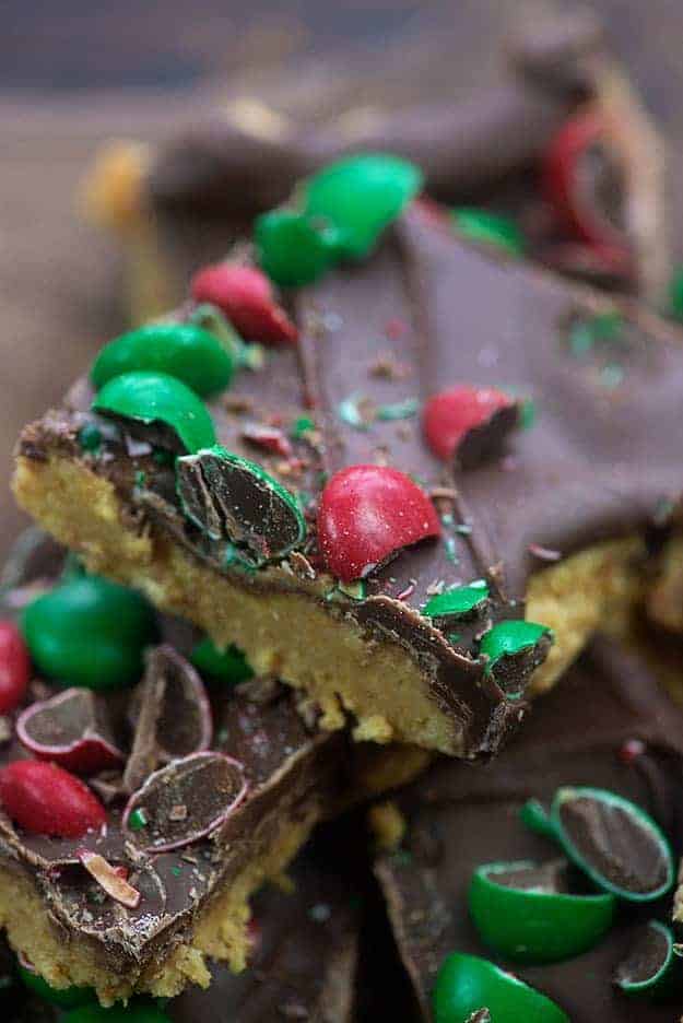Peanut butter bars topped with chocolate and M&M's.