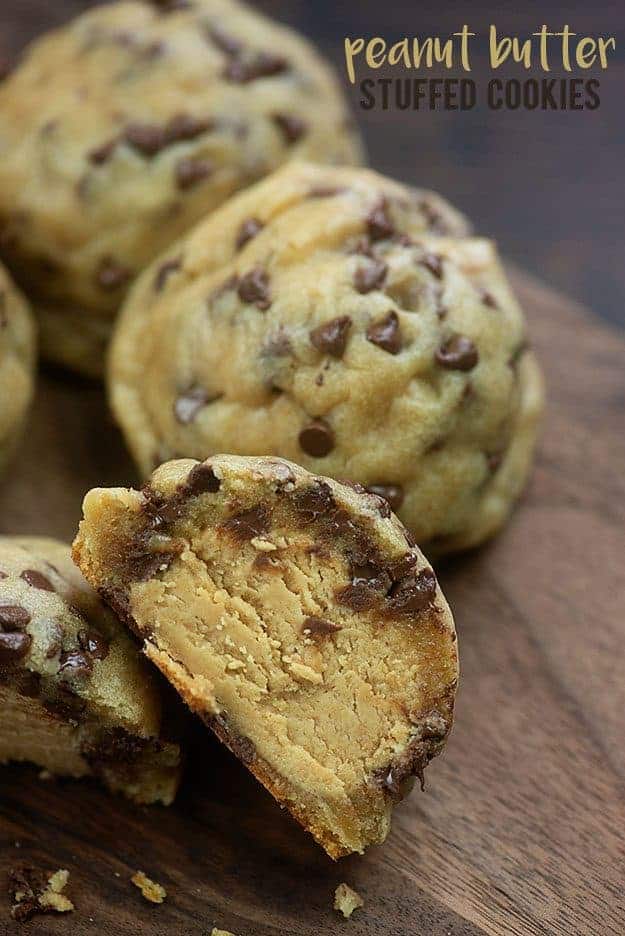 Chocolate chip cookie cut in half showing peanut butter filling.