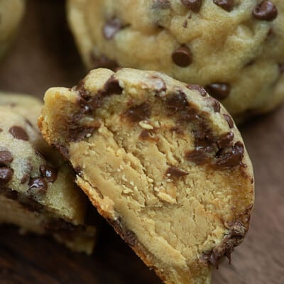 A close up of a stuffed chocolate chip cookie.