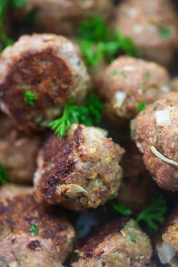 A close up of a stack of meatballs.