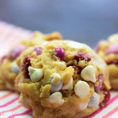 Close up of cookies leaning on each other on a striped napkin.