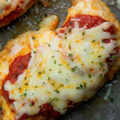 A closeup of chicken parmigiana