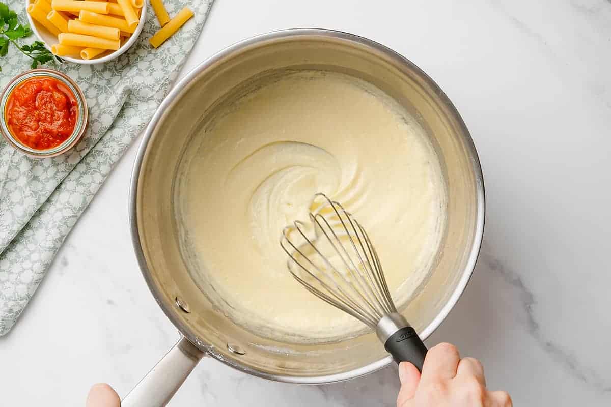 bechamel sauce in saucepan.