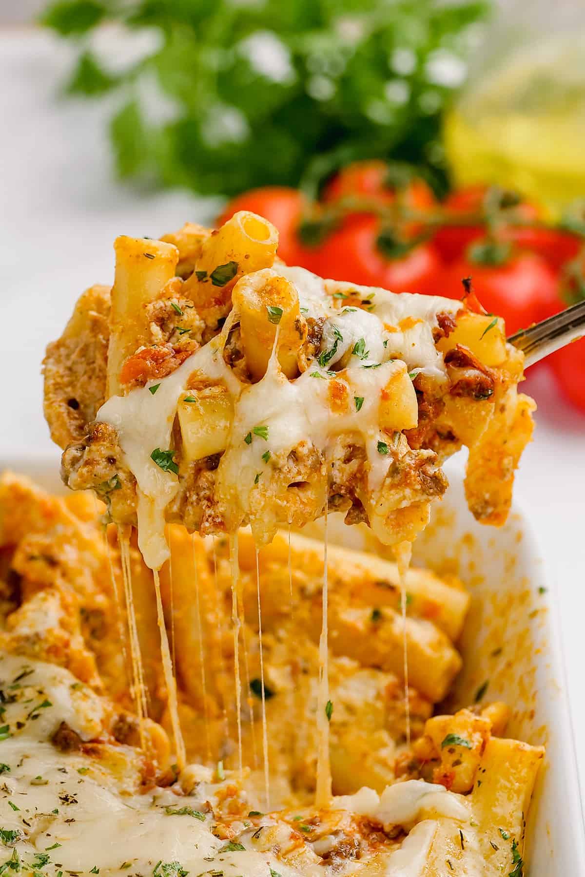 cheesy baked ziti in dish.