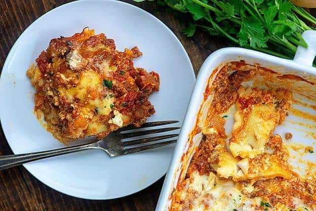 cheesy lasagna recipe on white plate