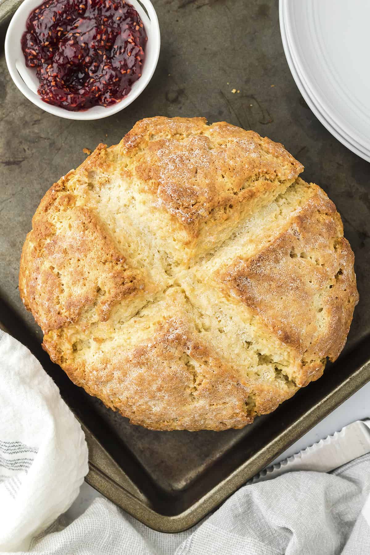 Overhead view of Irish soda bread on sheet pan.