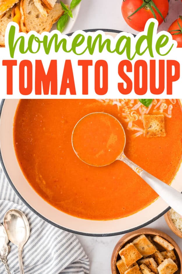 Tomato soup on ladle in white pot.