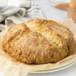 Irish soda bread on white plate.