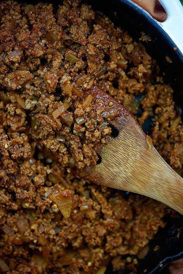 A pan filled with taco meat.