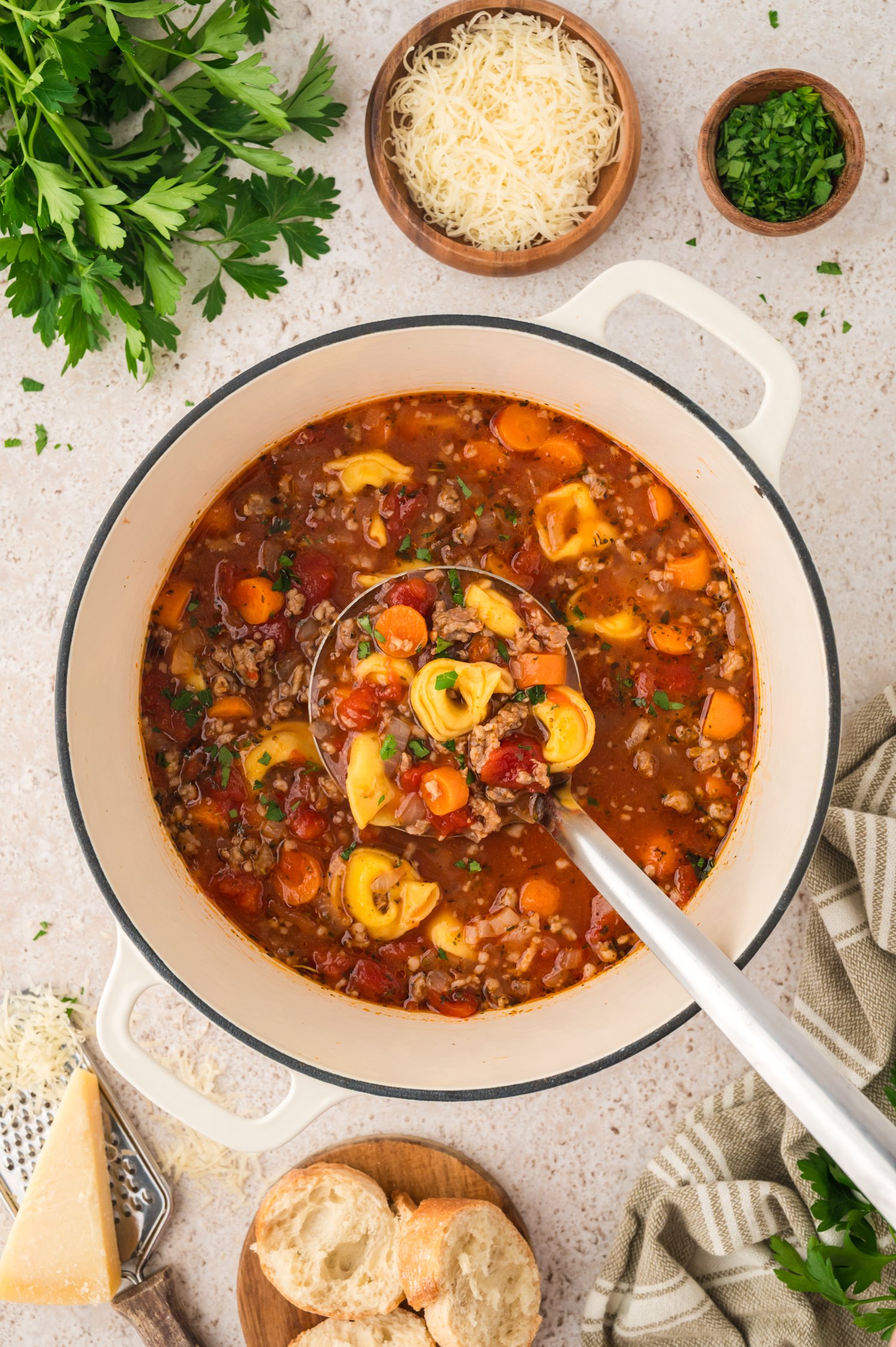 Sausage and tortellini soup in pot.
