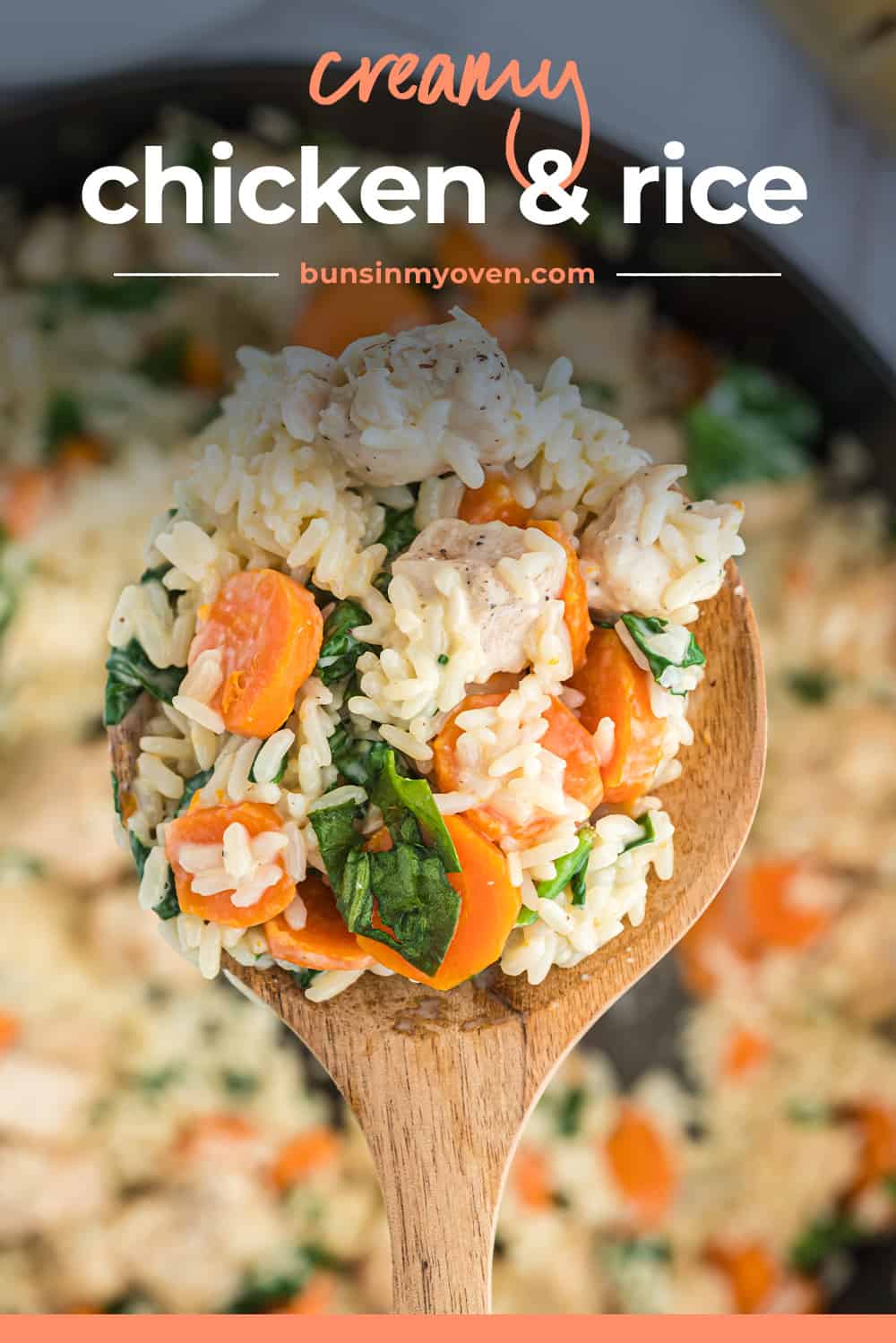 creamy chicken and rice on wooden spoon.