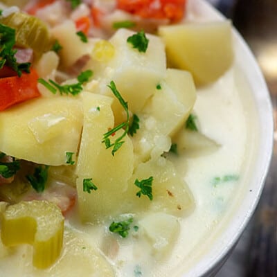 Close up of potatoes on a small white plate.