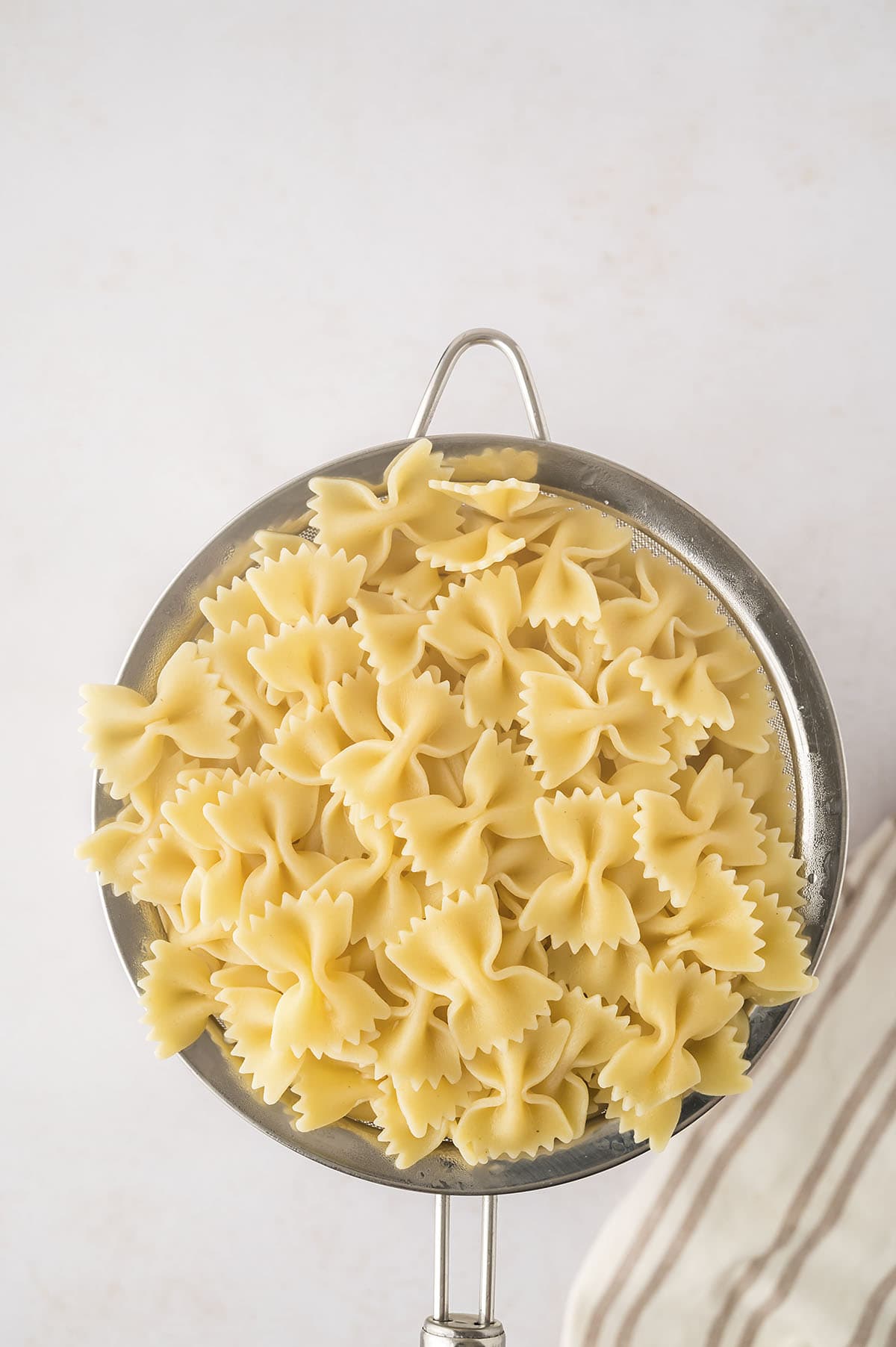 Pasta in strainer.