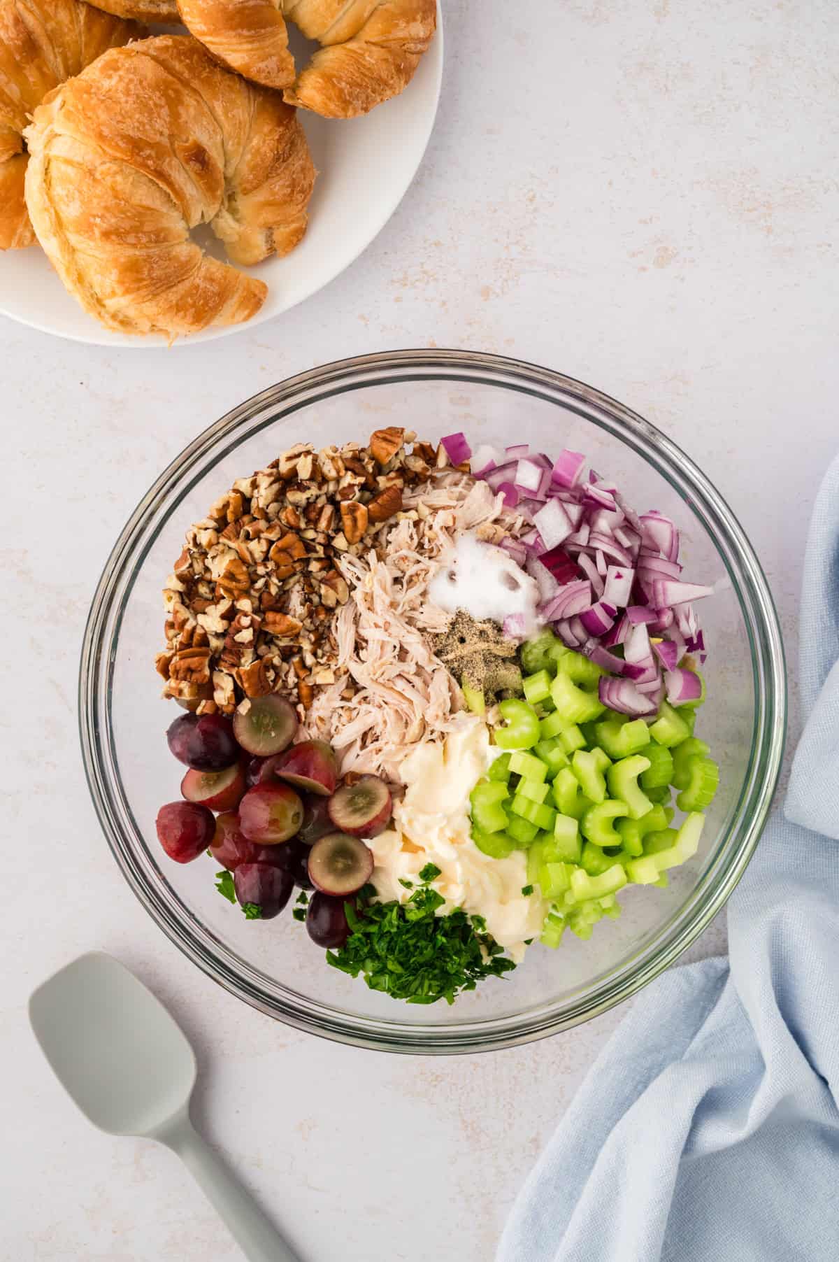 chicken salad recipe with grapes and pecans in glass bowl