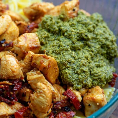 chicken with pesto in glass bowl