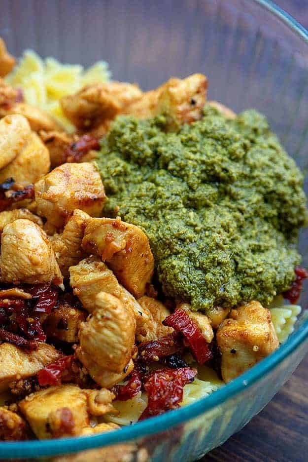 chicken with pesto in glass bowl