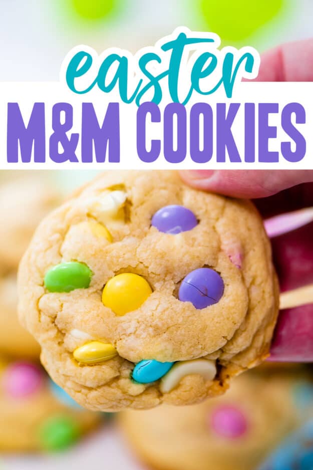 Hand holding an Easter cookie.