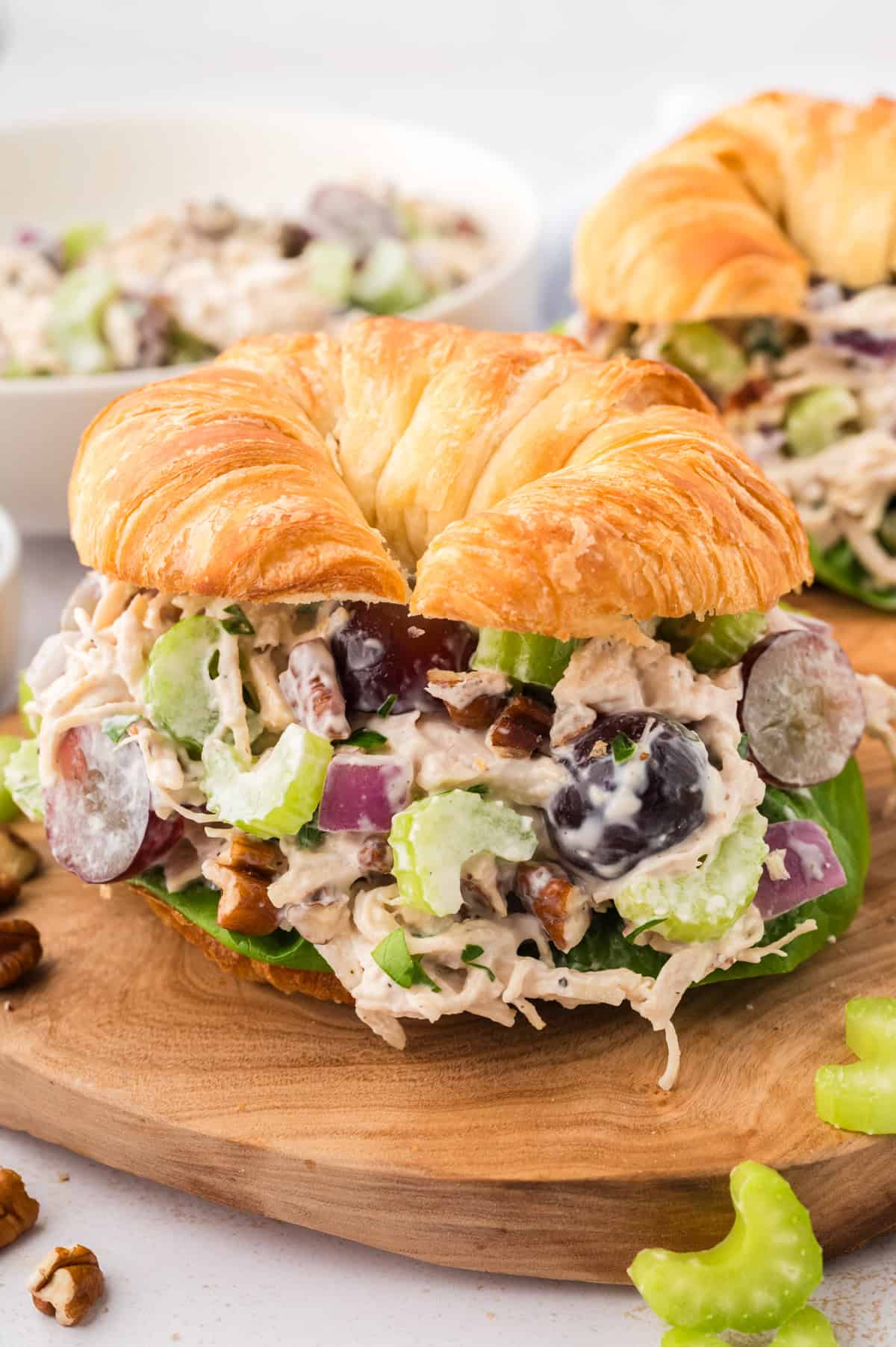 Chicken salad recipe with grapes and pecans on croissant.