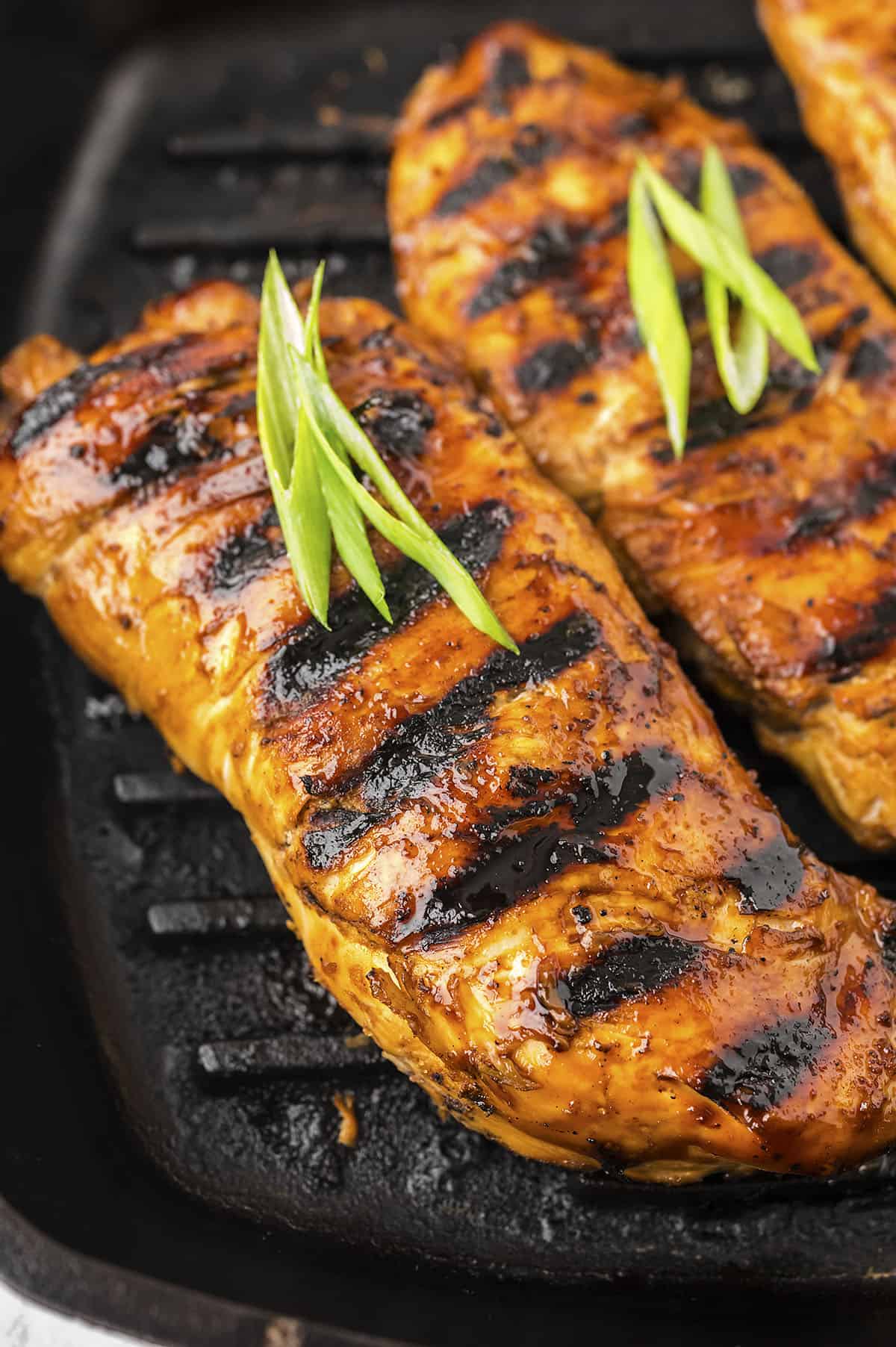 Grilled teriyaki chicken on grill pan.