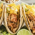 Chicken tacos lined up.