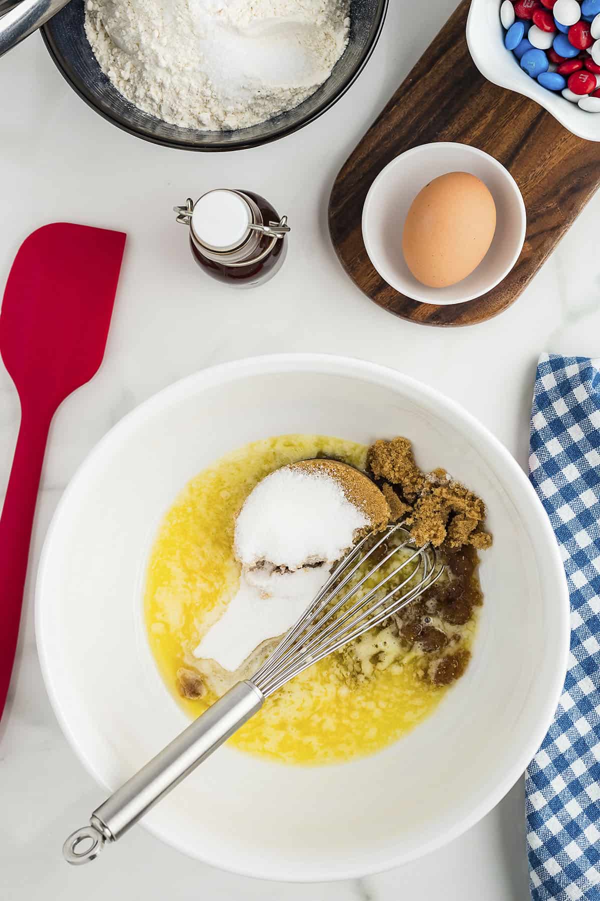 Melted butter and sugar in mixing bowl.