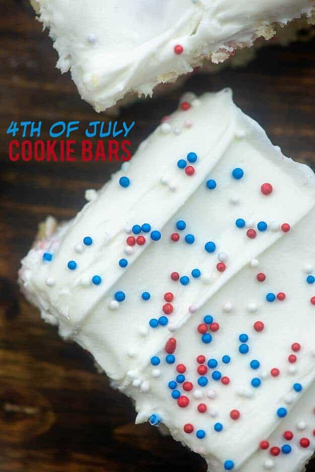 Close up of red white and blue sprinkles on white icing.