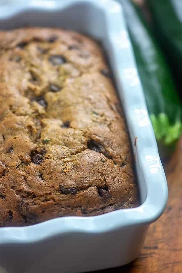 A loaf of zucchini bread in a bread pan.