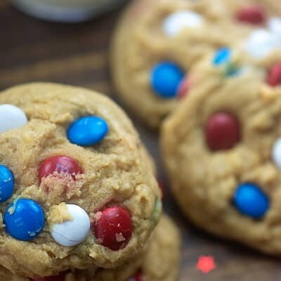 Several cookies on a cutting board.