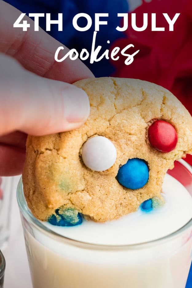 cookie being dunked into a glass of milk.
