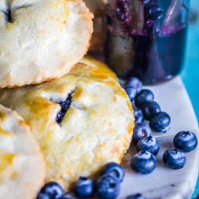 Blueberries and cookies on a cutting board