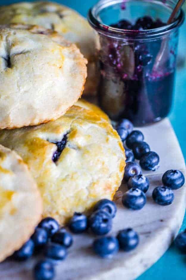 Blueberries and cookies on a cutting board 