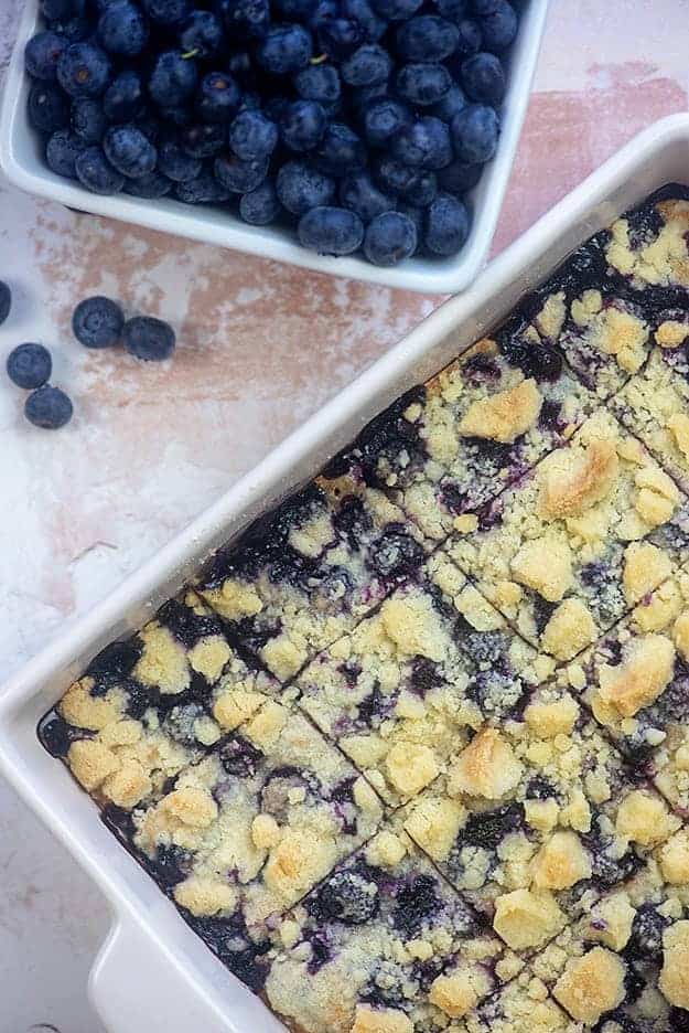 Blueberry bars cut into squares and in baking pan 