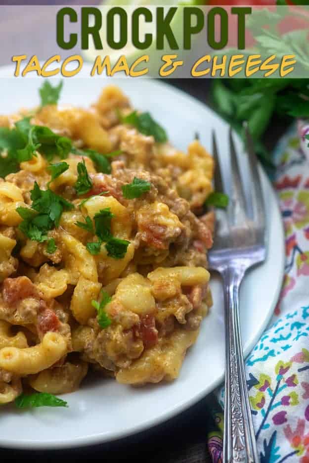 Small white plate with taco flavored macaroni and cheese with a fork.