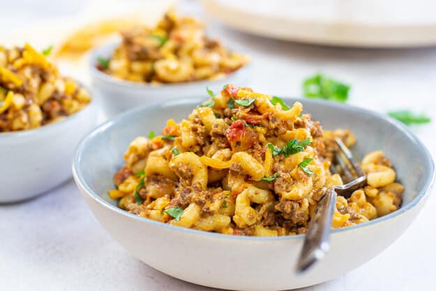 bowl piled high with mexican mac and cheese.