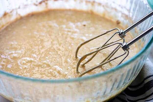 apple cake batter in glass bowl.