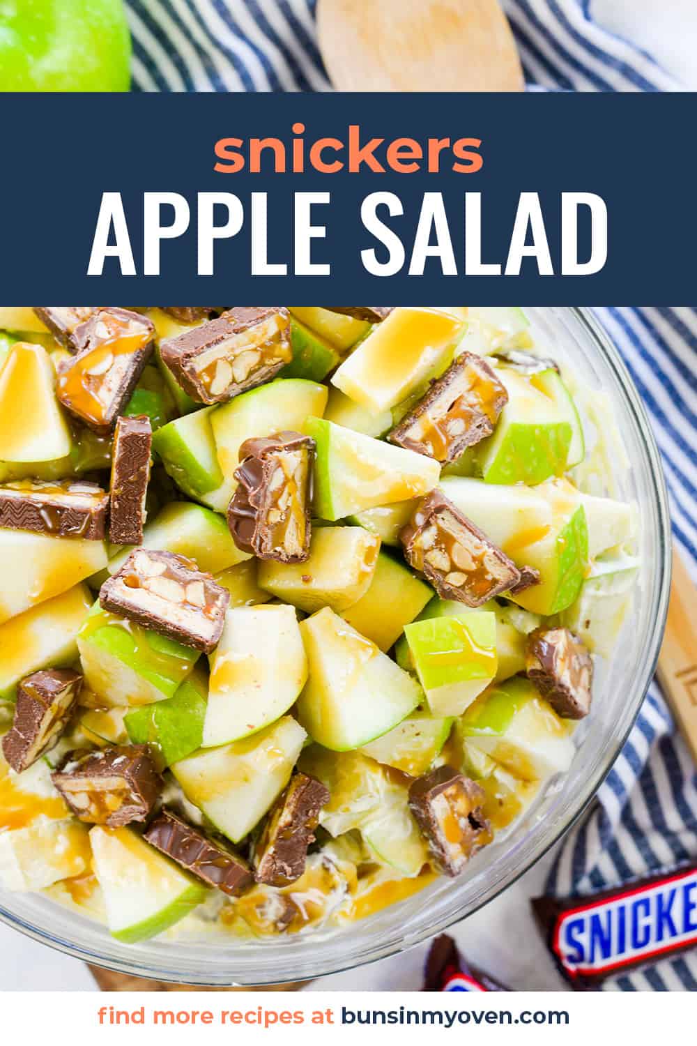Snickers apple salad in glass bowl.