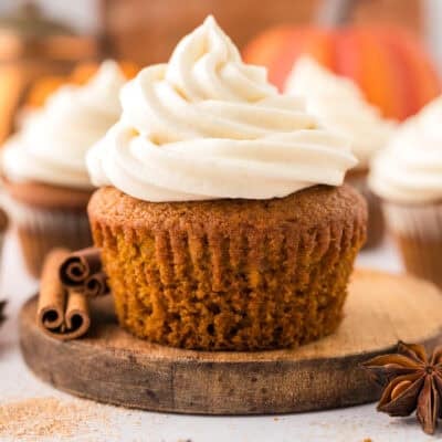 Pumpkin cupcake recipe topped with cream cheese frosting.