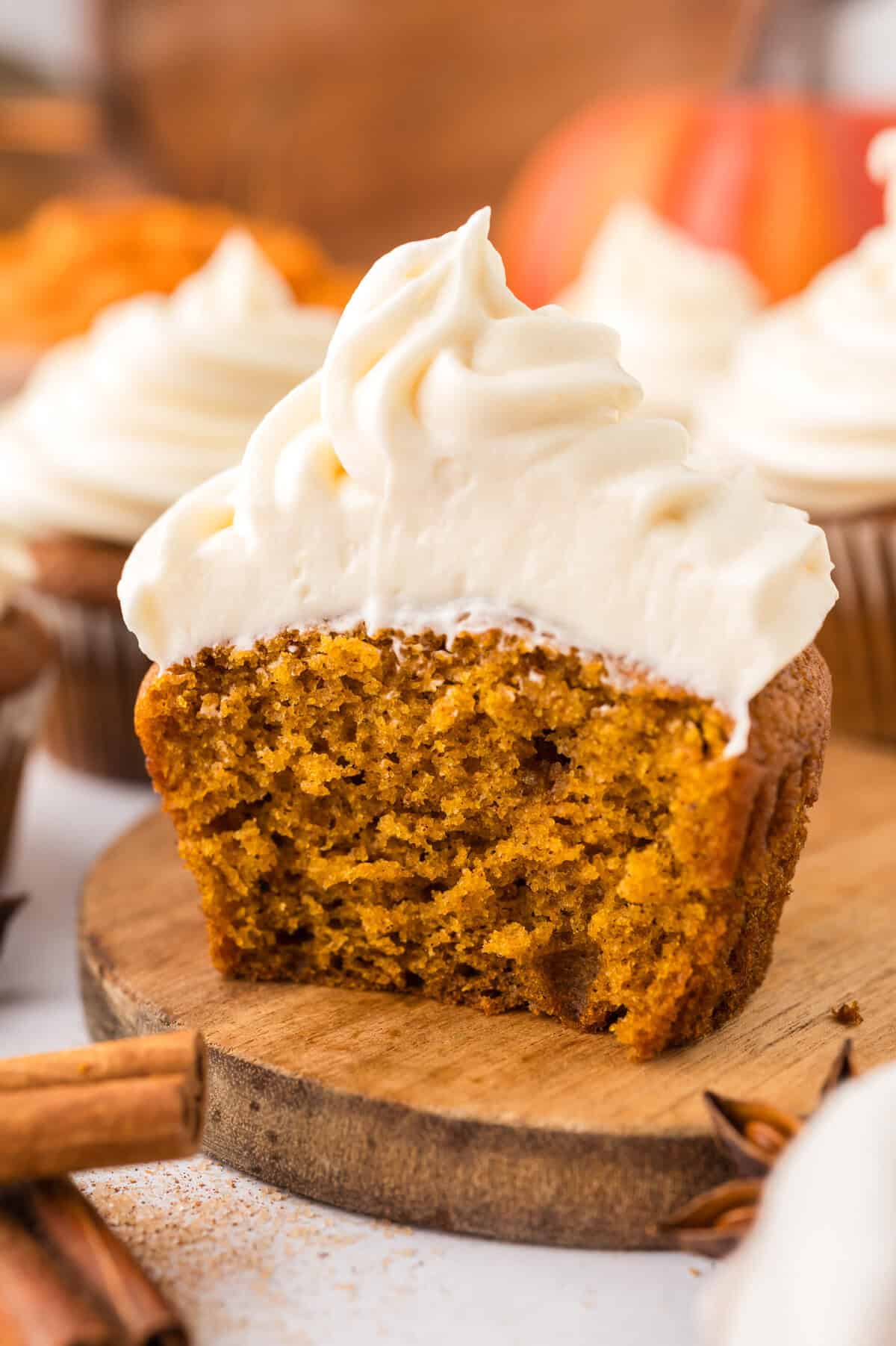 Moist pumpkin cupcake topped with cream cheese frosting.