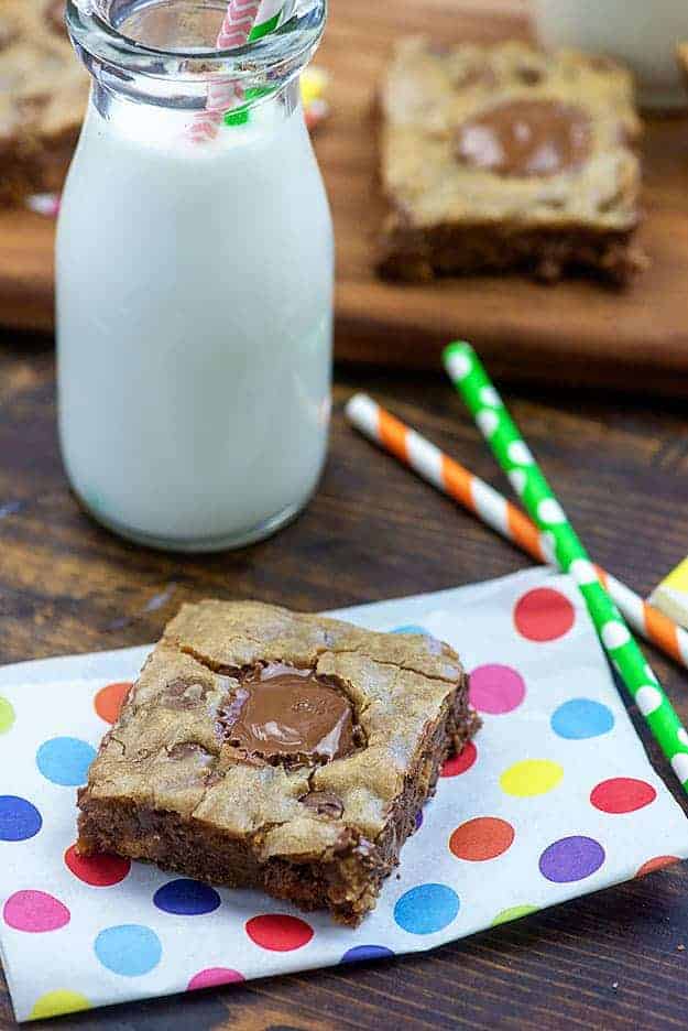 peanut butter cup in a blondie on top of a polka dot napkin.