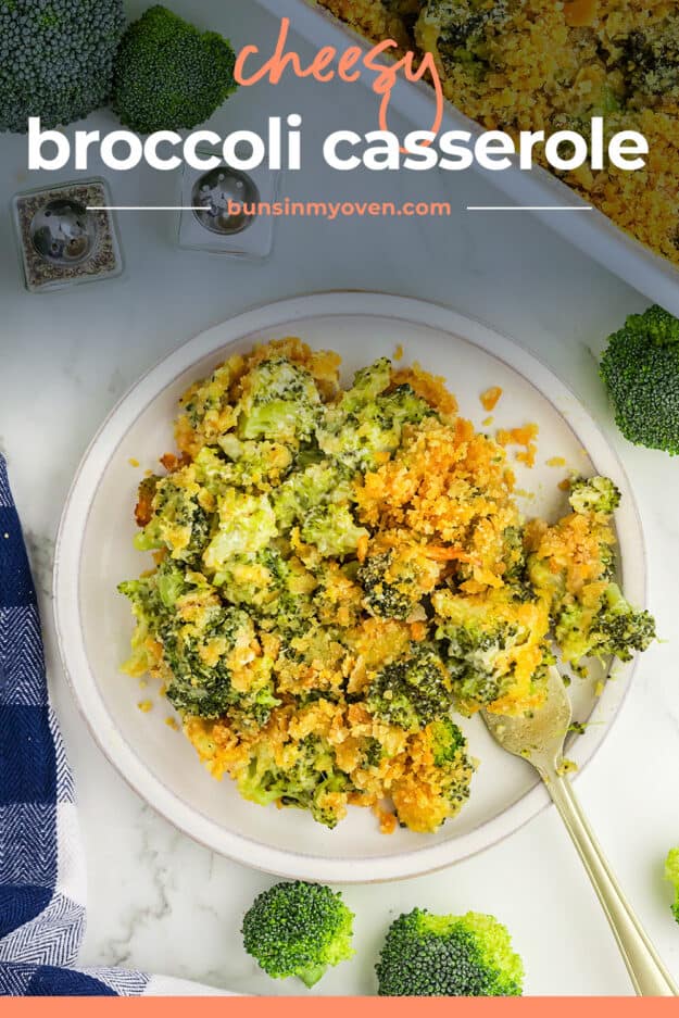 Broccoli casserole on white plate with fork.