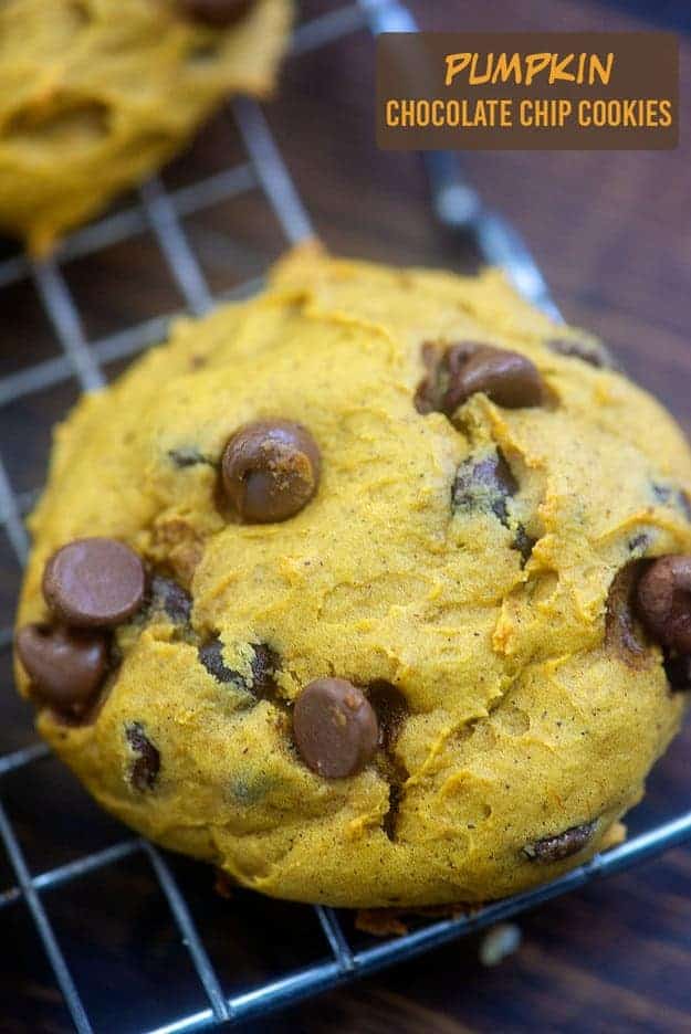 A pumpkin cookie on a cooling rack.