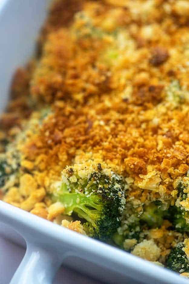 A close up of broccoli in a baking dish.