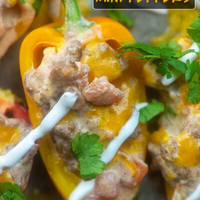 Close up of peppers with melted cheese and sour cream on top.