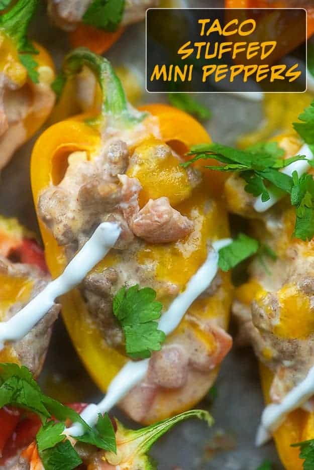 Close up of peppers with melted cheese and sour cream on top.